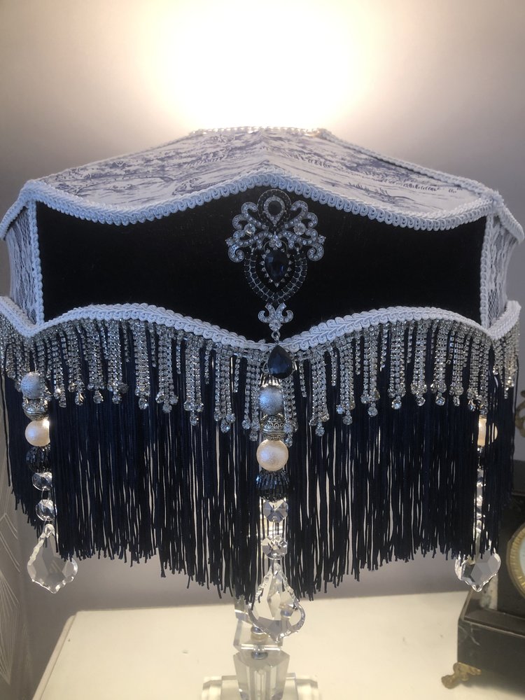 Decorative Victorian lampshade with blue velvet toile and lace panels and dark blue fringes. with glass crystal tassel and diamonte trim, front view