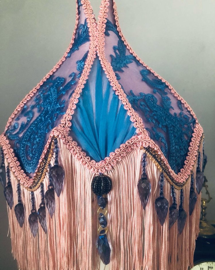 Close-up of lace overlay – “Powder blue and lavender lace delicately overlaid on pink silk tulip lampshade – elegant Victorian handmade detail.