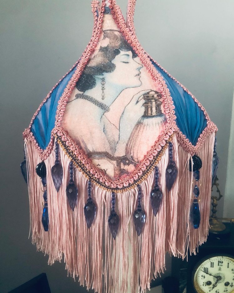 Close-up of Edwardian woman panel – “Detailed close-up of Edwardian lady in her powder room surrounded by pink silk, lace, and chiffon panels on a handmade Victorian lampshade.”