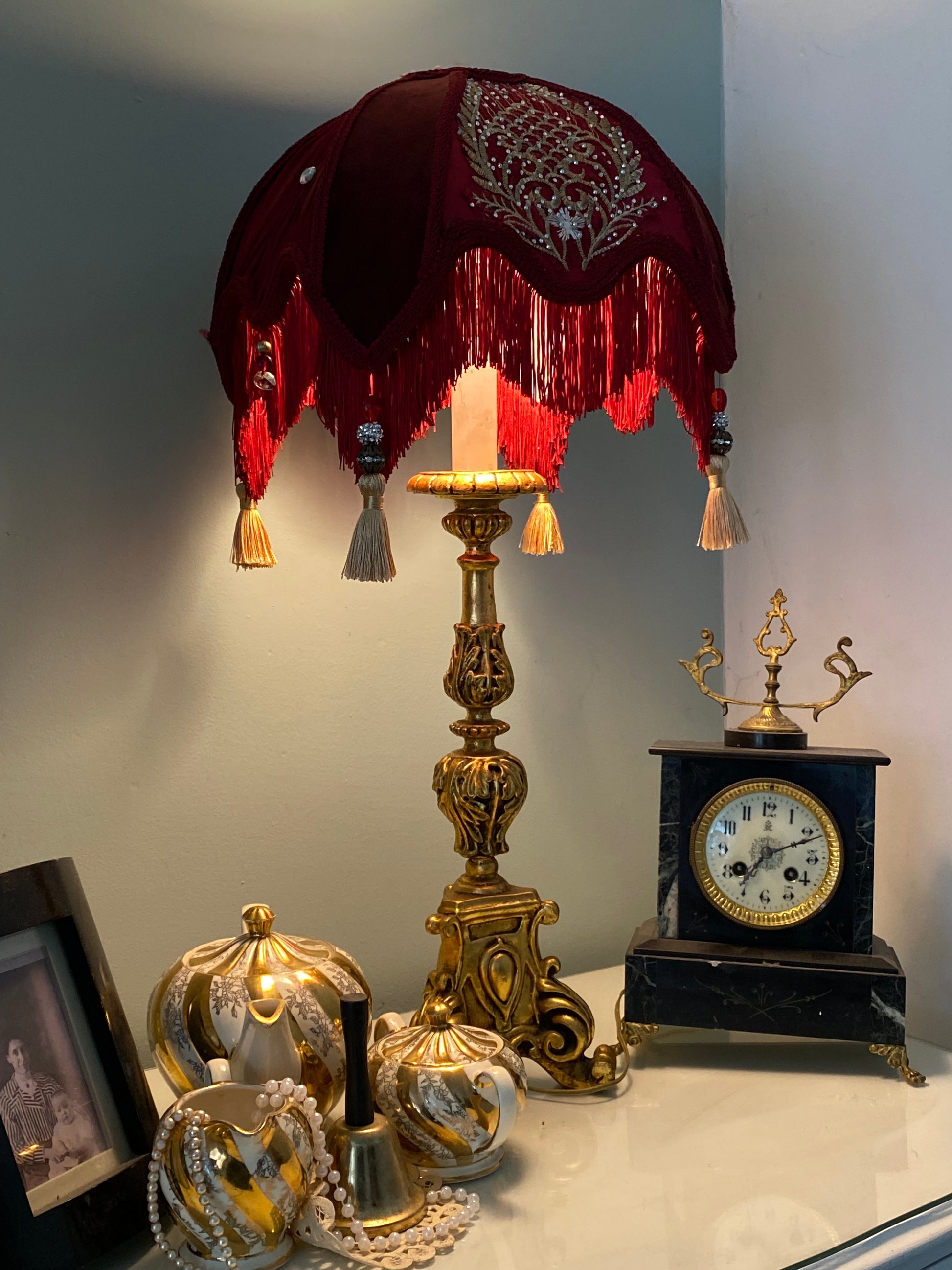 Lifestyle / styled angle – “Victorian-style red velvet and silk lampshade with gold chiffon embroidery, burgundy pleated chiffon panels, and ruby jewel trim – elegant vintage home décor.”