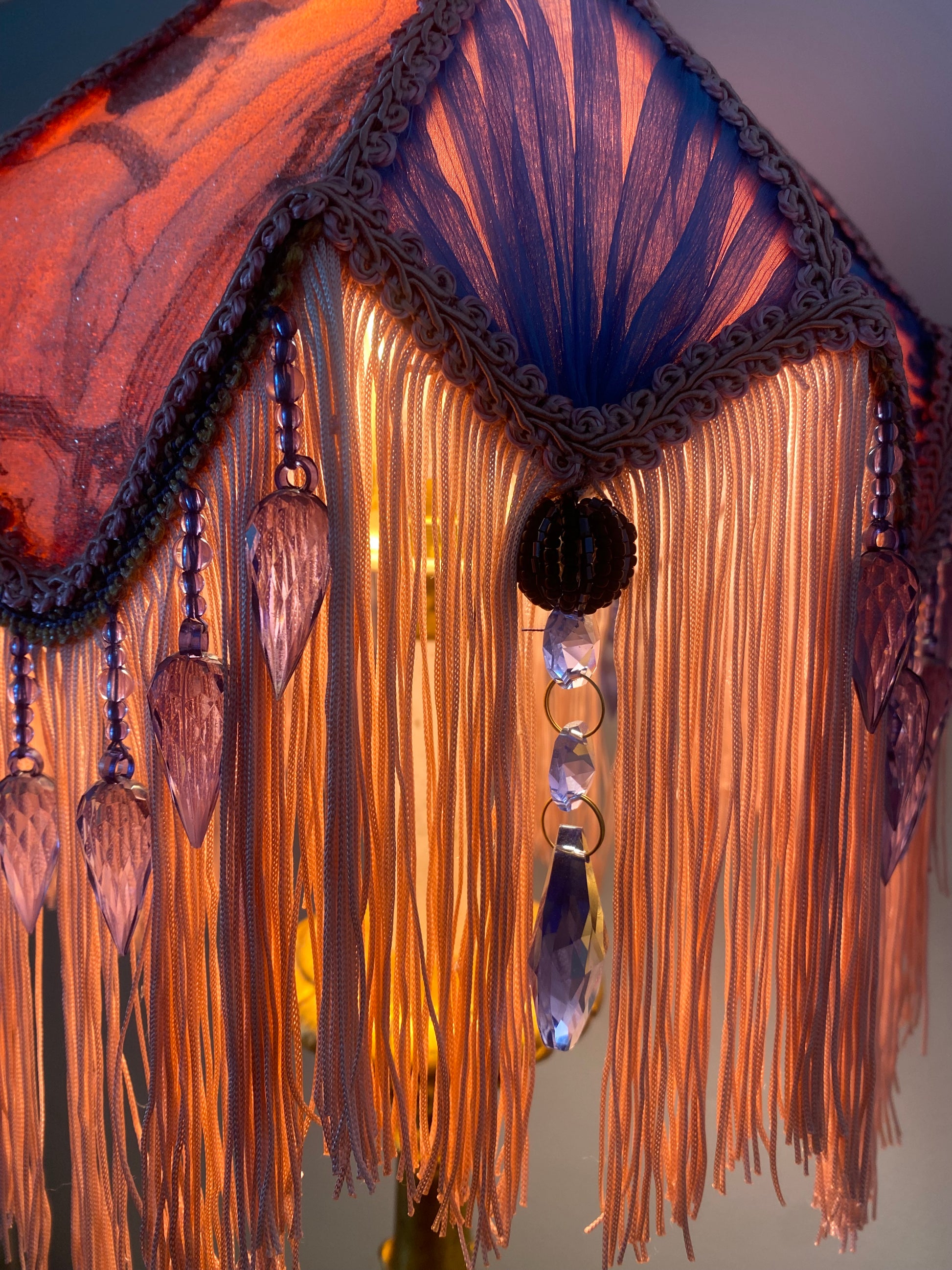 Close-up of pleated chiffon panel – “Pleated chiffon panel in soft pastel tones between lace sections on a pink Victorian tulip lampshade – luxury handmade period design.”