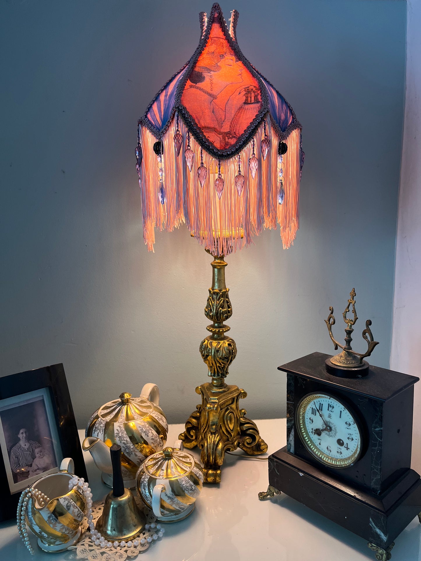 Lit ambience shot – “Victorian tulip-shaped silk lampshade illuminated to reveal Edwardian lady image, lace details, and pastel glow – romantic vintage lighting for elegant interiors.”