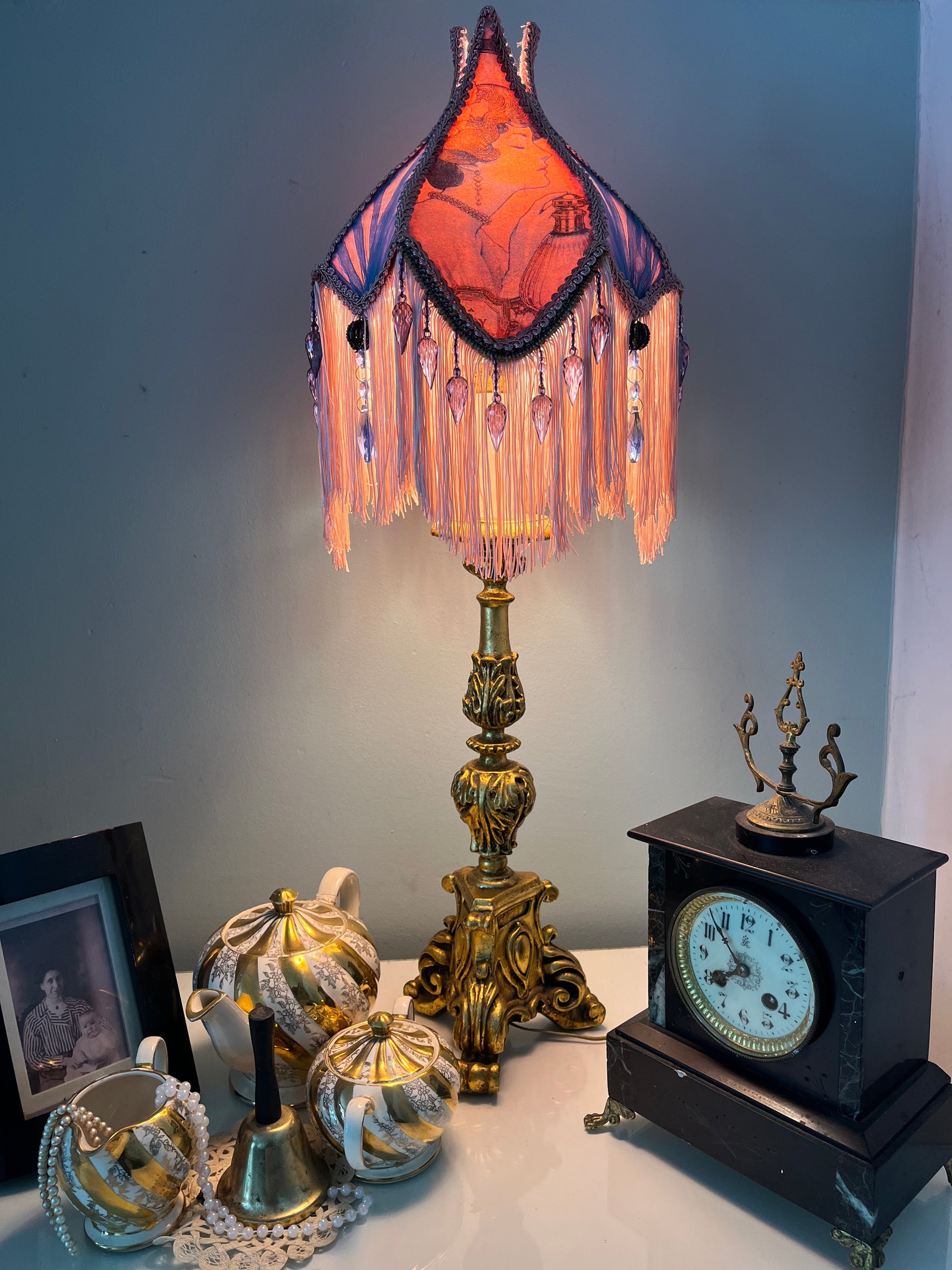 Lit ambience shot – “Victorian tulip-shaped silk lampshade illuminated to reveal Edwardian lady image, lace details, and pastel glow – romantic vintage lighting for elegant interiors.”