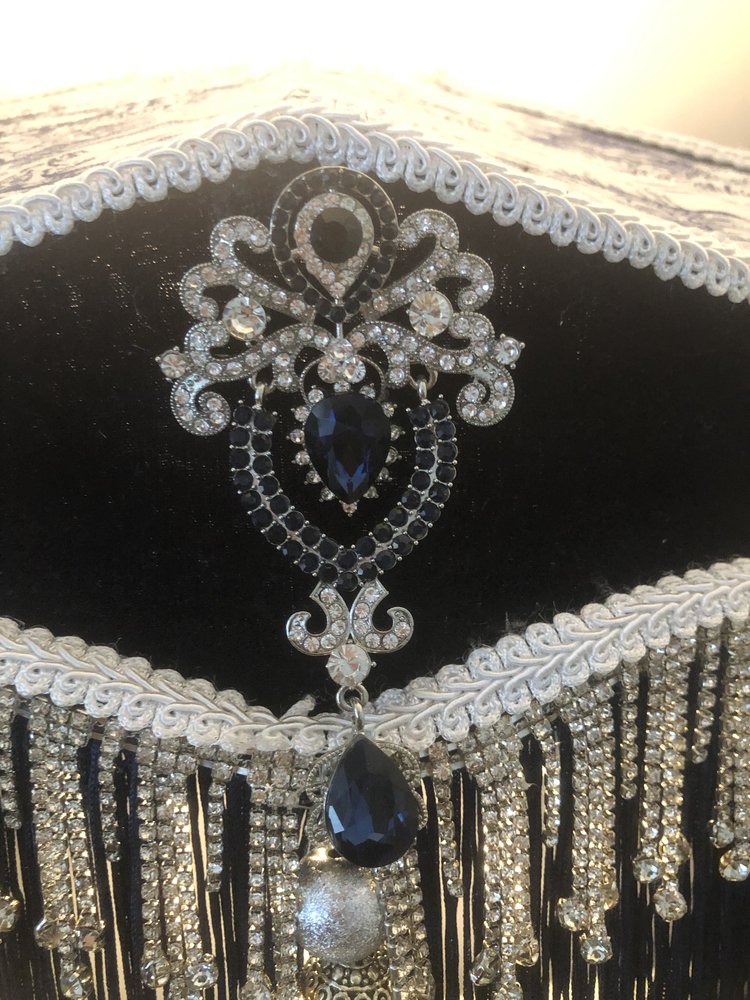 Decorative Victorian lampshade with blue velvet toile and lace panels and dark blue fringes. with glass crystal tassel and diamante trim, Sapphire and diamond  style brooch.Close up