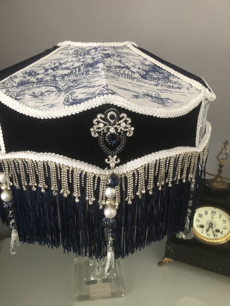 Decorative Victorian lampshade with blue velvet toile and lace panels and dark blue fringes. with glass crystal tassel and diamonte trim,  Top view 